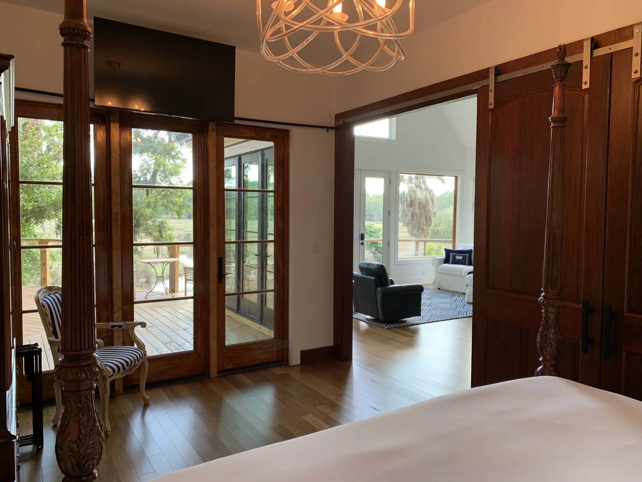 View from the master bedroom at Charleston Treehouse into the living room and out to the canopy