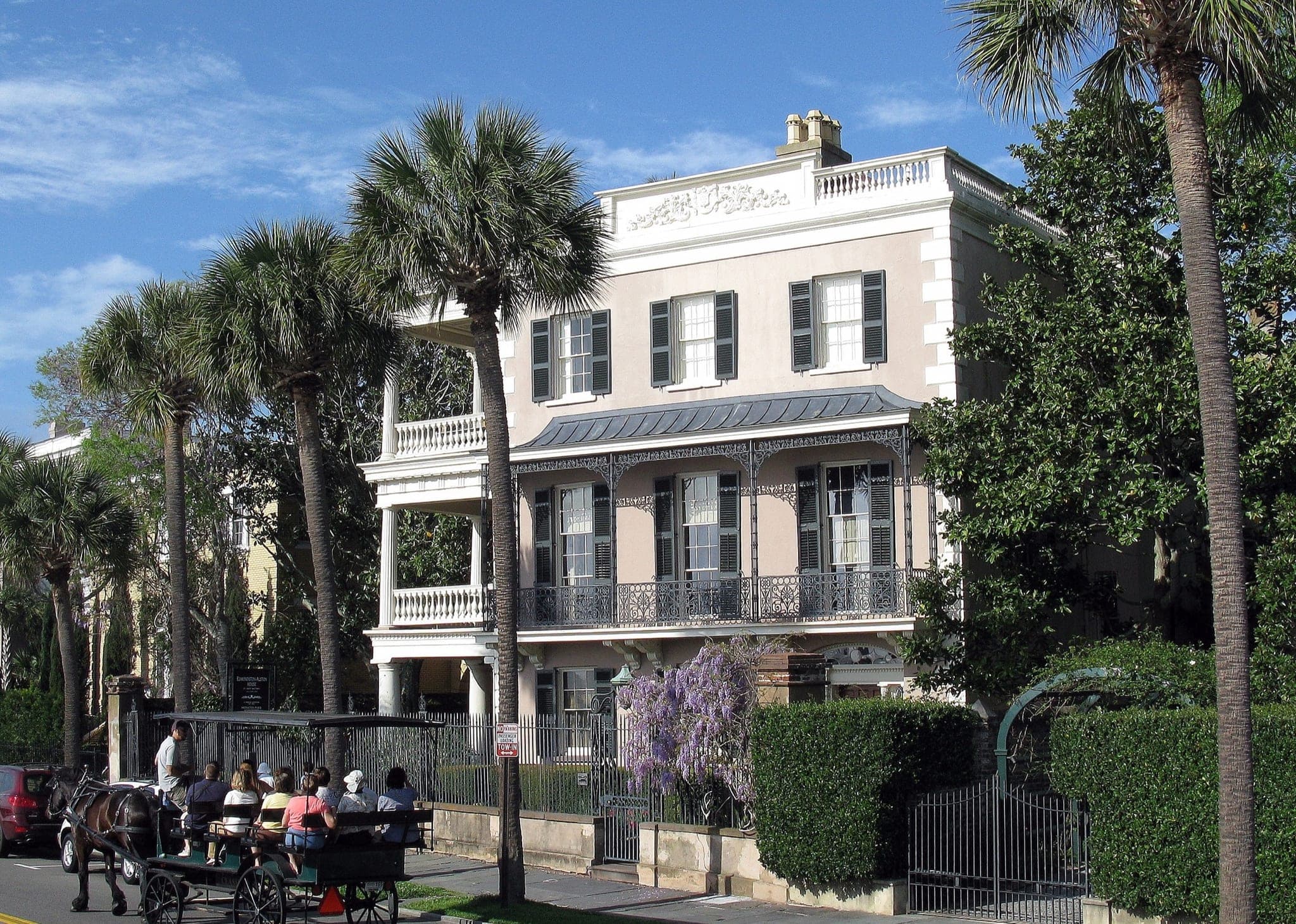 The Edmondston-Alston House on the Battery in Charleston, with a carriage tour passing by